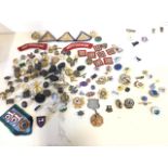 A collection of enamelled and military badges, some cloth, buttons, etc. (A lot)