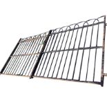 A pair of heavy wrought iron driveway gates with hooped spindles in rectangular frames, complete