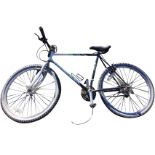 An Emmelle 21 speed mountain bike with gel seat, Shimano gears, straight handlebars, Jones tyres,