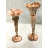 A hallmarked silver trumpet vase with scalloped rim raised on weighted base - Birmingham, 7in; and