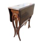 A late Victorian mahogany occasional table with scalloped drop leaves supported on square tapering