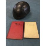 An early motorcycle pot helmet with leather interior; and two 1940s/50s motorcycling books - The