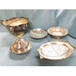 Five pieces of silver plate - a scalloped punch bowl with lion handles and ladle, a domed muffin