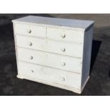 A painted Victorian pine chest of drawers with two short and three long graduated knobbed drawers,