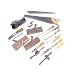 A box of miscellaneous old tools - moulding planes, chisels, saws, soldering irons, a marker