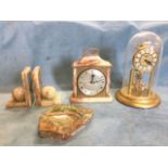 Three marble pieces - a pair of ball book-ends, a rough hewn ashtray, and a mantleclock with brass