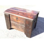 A stained pine Dutch mariner style domed coffer, the three board ribbed top on dowel hinges above