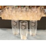 A collection of Grolsh embossed pint lager glasses. (33)