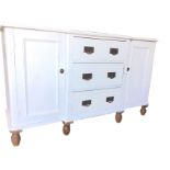 A Victorian painted pine breakfront dresser base, the moulded top above three central drawers