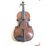A nineteenth century violin in pine with hardwood back, having scratched decoration to scroll and