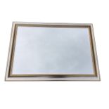 A contemporary mirror with rectangular bevelled plate in silvered cushion moulded frame. (29in x