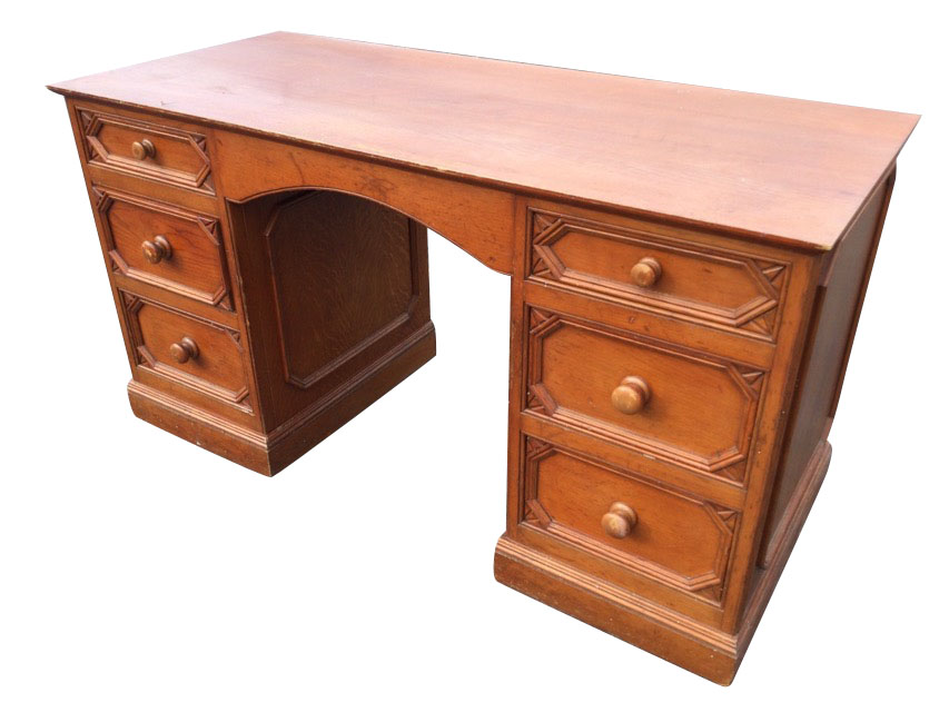 An oak kneehole desk by Smallbone, with rectangular top above an arched frieze apron and two