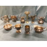 Miscellaneous silver plated items including tankards, a cup, jugs, a trumpet vase, a matching