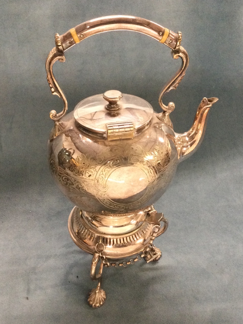 A small Victorian foliate engraved tea kettle on stand with burner, the ball shaped hinged pot on - Image 2 of 3