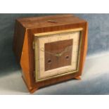 A deco walnut cased mantleclock with square dial under convex glass with brass frame, the Smiths