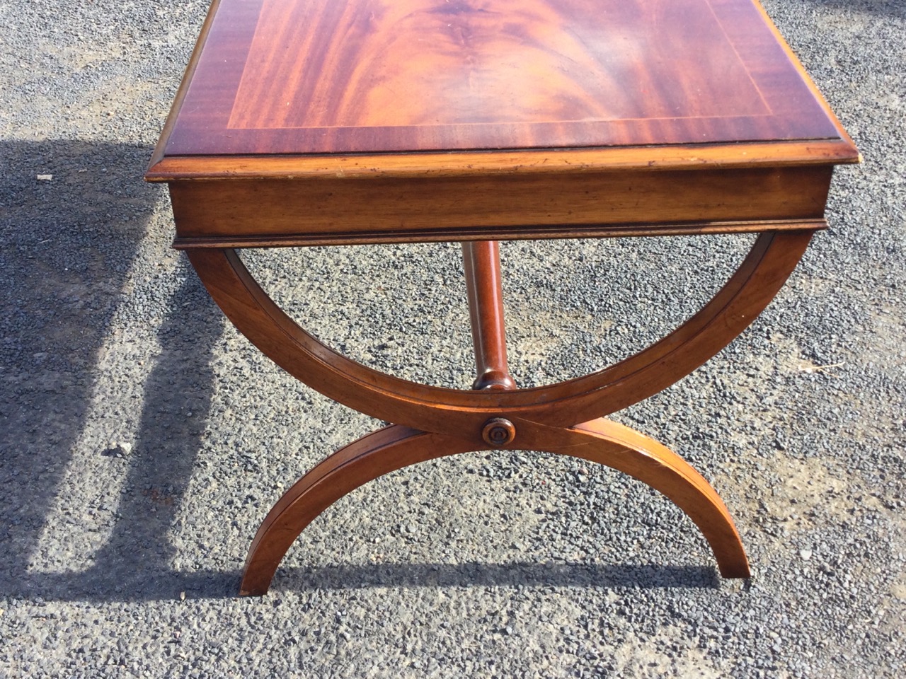 A rectangular mahogany coffee table, the crossbanded moulded top with plain apron raised on cradle - Image 3 of 3