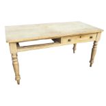 A Victorian pine farmhouse kitchen table, the rectangular top with rounded corners, above two