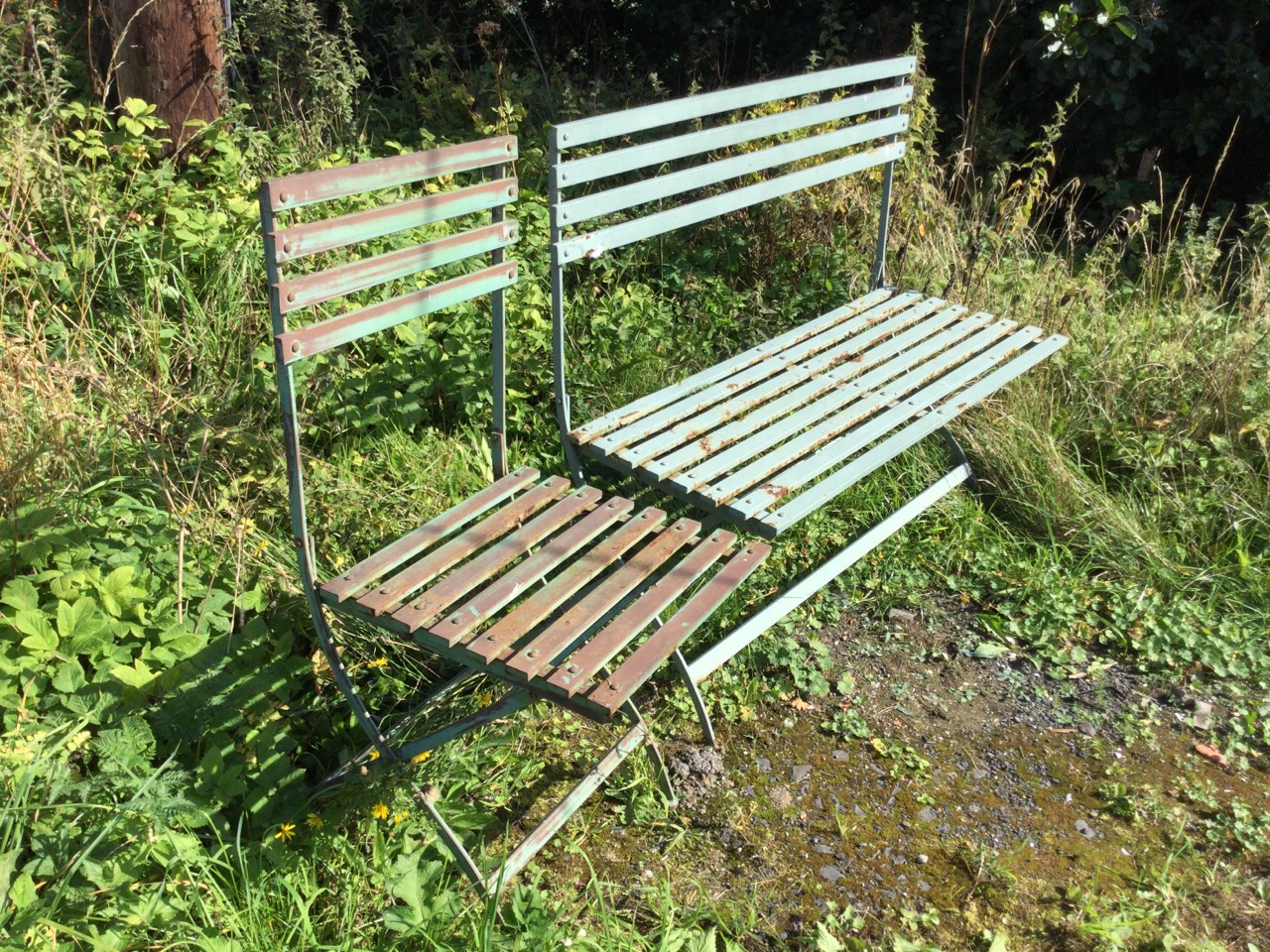 A folding painted metal garden bench & chair, the slatted backs and seats on iron cross-frames. (2) - Image 2 of 3