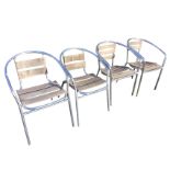 A set of four aluminium tube framed garden armchairs with slatted wood backs & seats, raised on