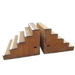 A pair of substantial wood platform steps, each piece with five hardwood treads, the box sections