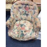 A Victorian mahogany spoonback button upholstered armchair with loose covers, the rounded back and