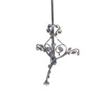 A Victorian wrought iron hanging light fitting with tubular pipe suspended by ceiling rose,
