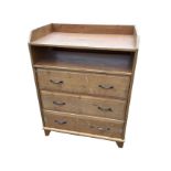 A pine chest of drawers with gallery to rectangular top above an open compartment, having three long