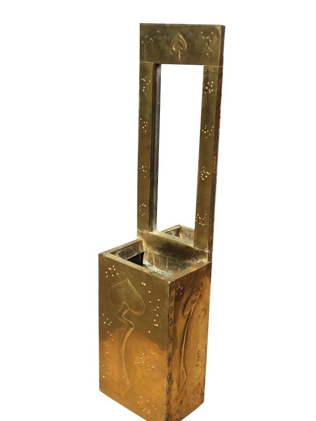 An art nouveau style brass wall pocket with rectangular frame to mirror above an open box, the brass