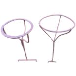 Two graduated circular wrought iron bowl stands, each with circular rings on three shaped