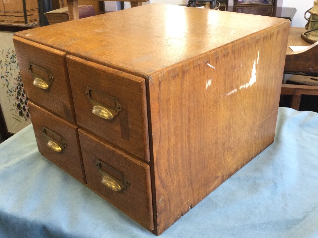 An Edwardian oak card index cabinet, with four drawers mounted with brass cup handles and label- - Image 3 of 3