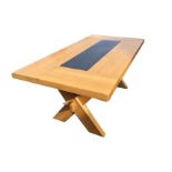 A rectangular contemporary oak dining table, the thick solid top inset with polished stone slab, the