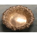 A Victorian hallmarked silver dish with foliate scrolled embossed border - Sheffield, 1901, 124g. (