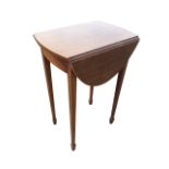 A small nineteenth century mahogany occasional table, with two drop-leaves forming an oval framed by