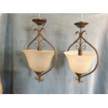 A pair of acid etched inverted bell shaped hall lights with decorative anthemion friezes to glass,