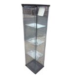 A square glazed display cabinet with four internal shelves and glass door. (16.75in x 14.5in x 64.