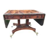 A George IV rosewood sofa table, the crossbanded top with brass stringing having two rounded drop