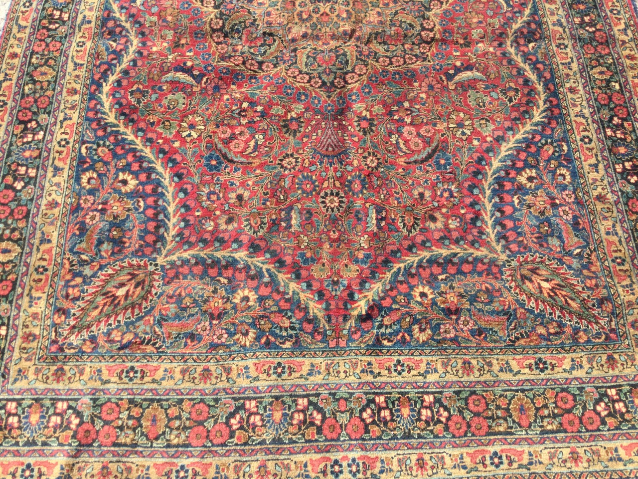 A fine Indian rug woven with floral medallion having scalloped borders on red field, overall - Image 2 of 3