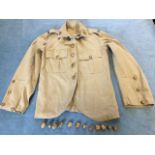 A KOSB overseas khaki dress tunic, complete with collar badges, epaulettes labels, embossed brass