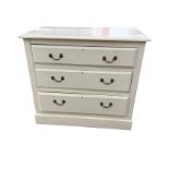 A painted Edwardian chest of three long drawers mounted with brass swan-neck handles, having