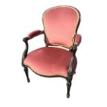 A wide seated nineteenth century fauteuil with later upholstery, the back in moulded frame having