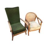 An oak easychair with arched cane back on dowelled frame with shaped arms and loose cushion seat;