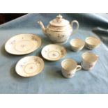 A nineteenth century Newhall tea-for-two set with oval teapot, cups & saucers and bowls, all