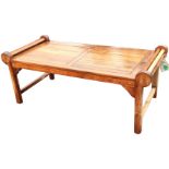 A rectangular teak garden table with slatted top and rounded ends, supported on rectangular legs and