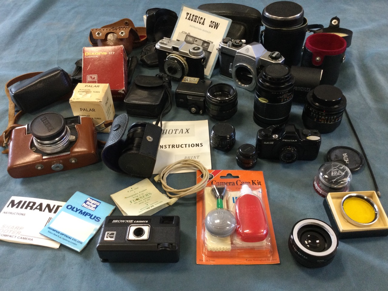 Miscellaneous cameras & photographic equipment including a leather cased Pentax, lenses, flash