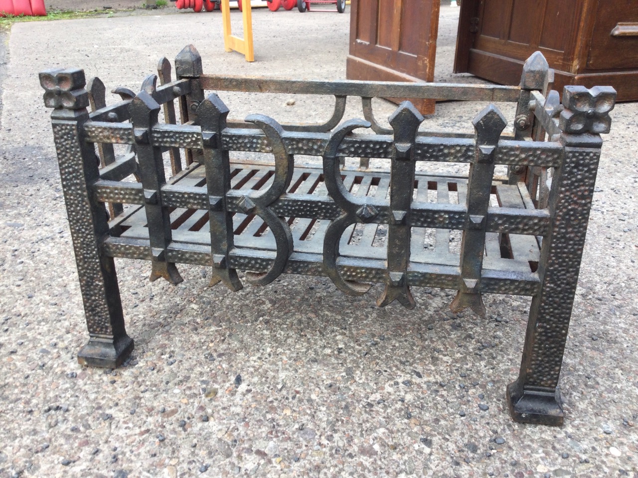 A cast iron dog grate, the rectangular basket with riveted grill sides, raised on square corners - Image 3 of 3