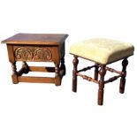 A carved oak box stool with rectangular hinged lid above a frieze with scroll carved panels,