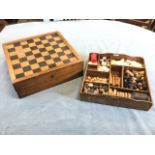 A French walnut games compendium, the dovetailed box with backgammon, chess & drafts boards having