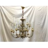 A large Dutch style silvered & gilt brass chandelier, with two tiers of scrolled branches supporting