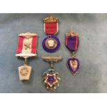 Three silver masonic medals with colourful enamelling - hallmarked; and another with wedge shaped