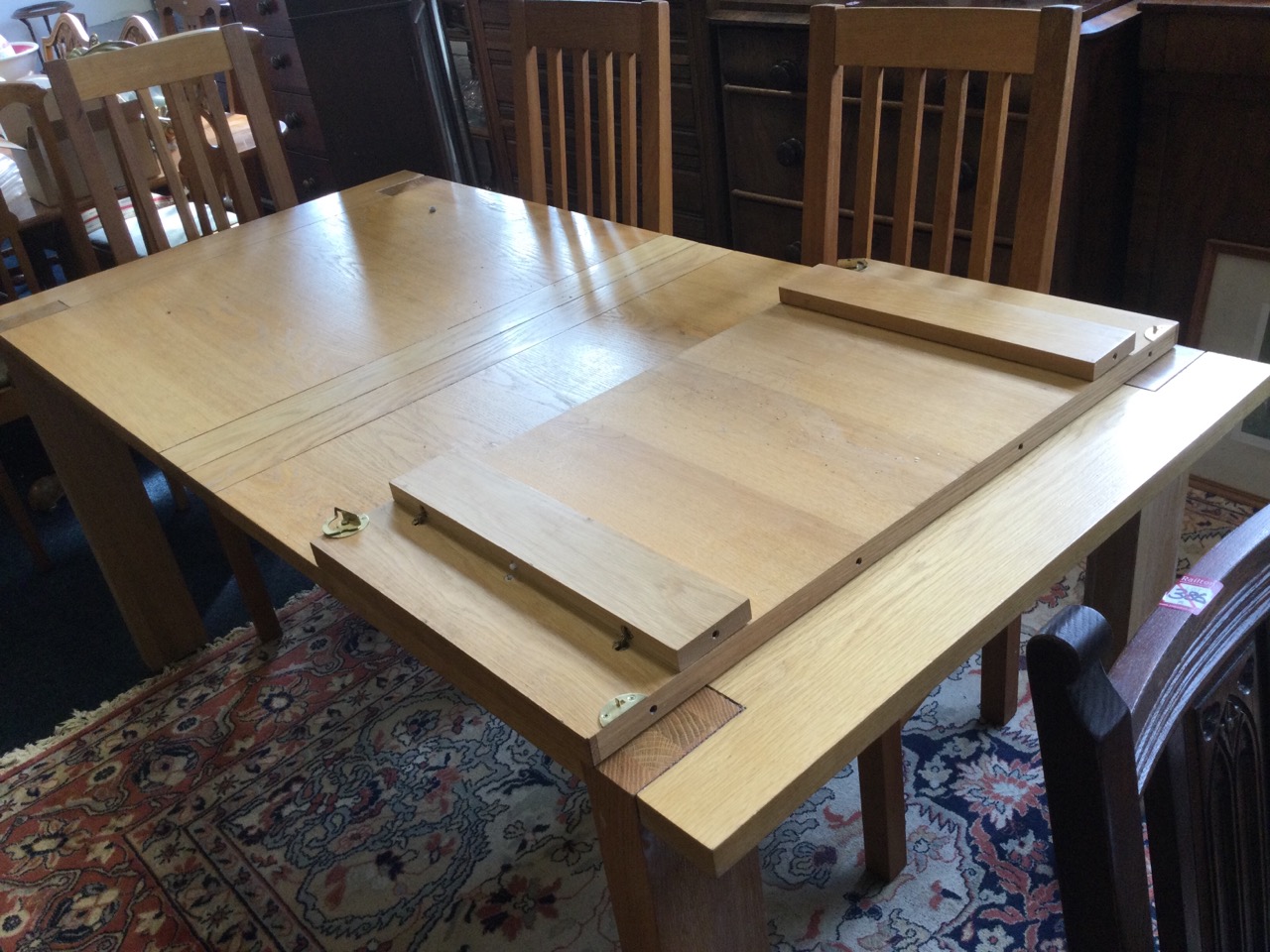A rectangular limed oak draw-leaf kitchen table, the cleated top on rectangular legs, with spare - Image 3 of 3